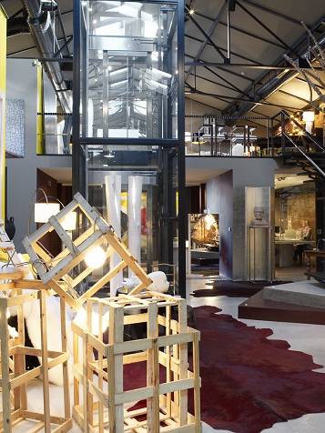 SAV here comes the sun showroom interior design architecture project luxury eclectic modern light pieces color yellow bordeaux mixture rustic