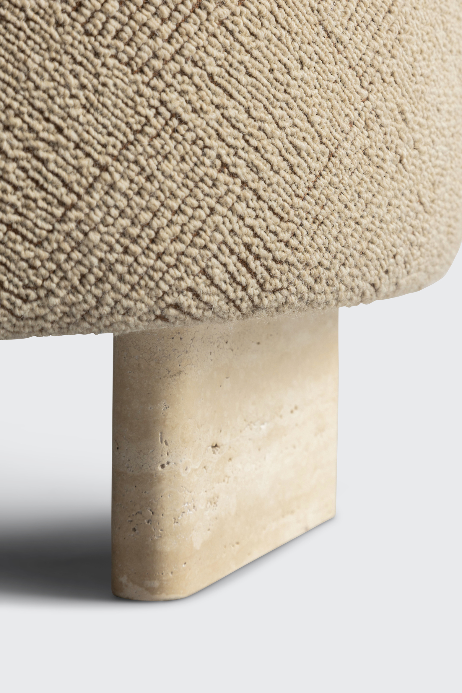 SAV travertine stone stool interior design architecture product seating luxury premium piece art beauty fashion naturalness virgin wool boucle yarns organically hand-crafted upholstery fabric luxurious natural stone feet
